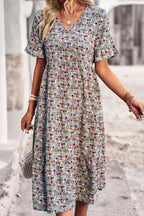 Light blue floral summer dress with a flowing, relaxed fit and delicate straps. Perfect for warm-weather outings. 9