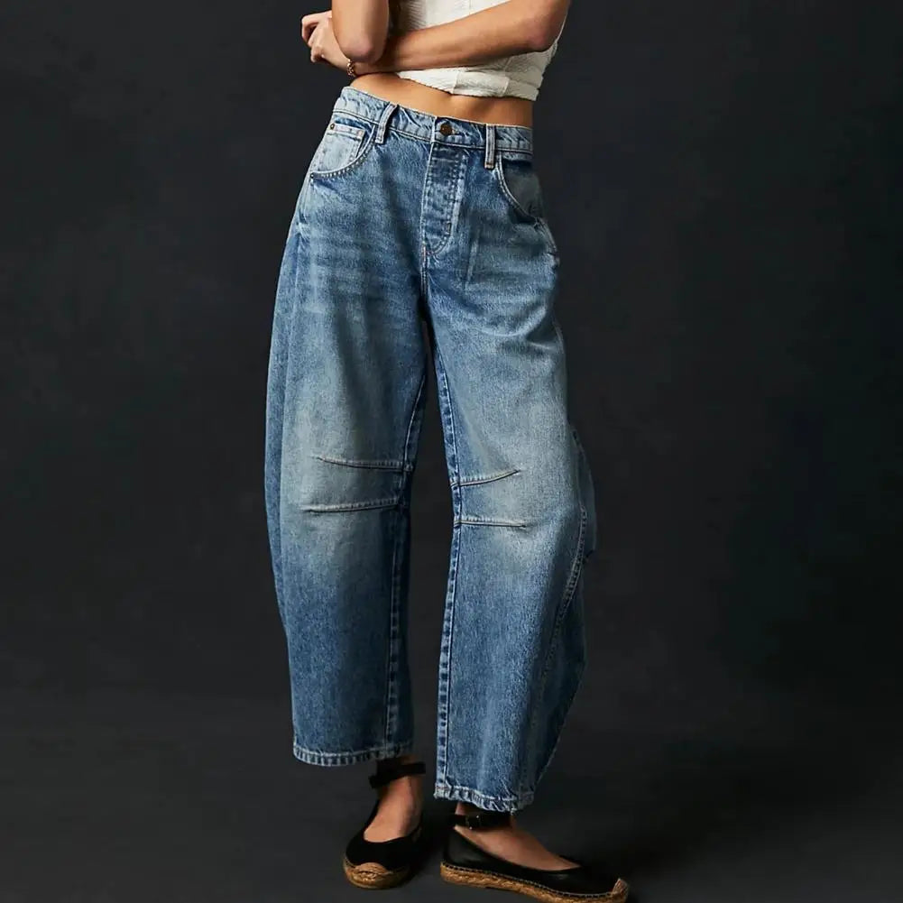 Light blue wide-leg jeans with a relaxed fit, featuring a classic five-pocket style and frayed hem. 10