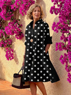 Light blue midi shirt dress with a button front, collared neckline, and long sleeves in a relaxed fit. 5