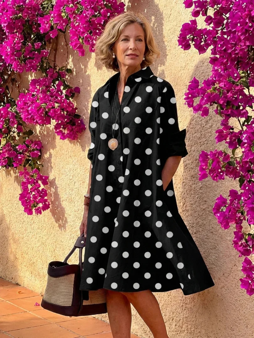 Light blue midi shirt dress with a button front, collared neckline, and long sleeves in a relaxed fit. 5