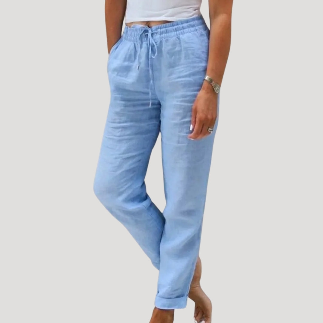 Lightweight cotton-linen trousers in soft beige with a relaxed fit and drawstring waist. Casual and comfortable style. 1