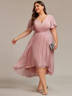 Plus size chiffon midi dress with a pleated double V-neck and flutter sleeves.