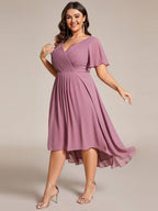 Plus size midi dress in blush pink with a double V-neck and ruffle sleeves, perfect for wedding guests. 12