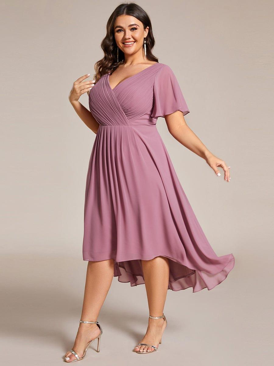 Plus size midi dress in blush pink with a double V-neck and ruffle sleeves, perfect for wedding guests. 12