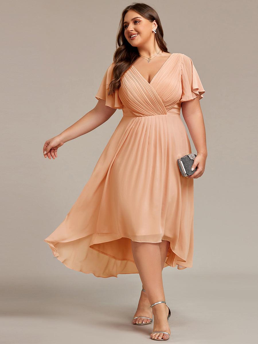 Plus size midi dress in blush pink with a double V-neck and ruffle sleeves, perfect for wedding guests. 13