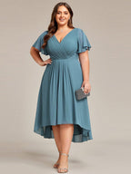 Plus size midi dress in blush pink with a double V-neck and ruffle sleeves, perfect for wedding guests. 15