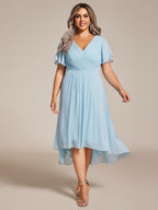 Plus size midi dress in blush pink with a double V-neck and ruffle sleeves, perfect for wedding guests. 16
