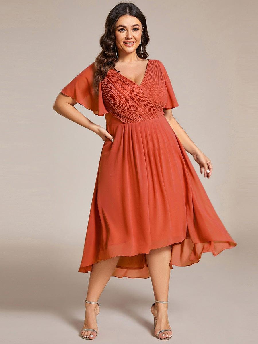Plus size midi dress in blush pink with a double V-neck and ruffle sleeves, perfect for wedding guests. 17