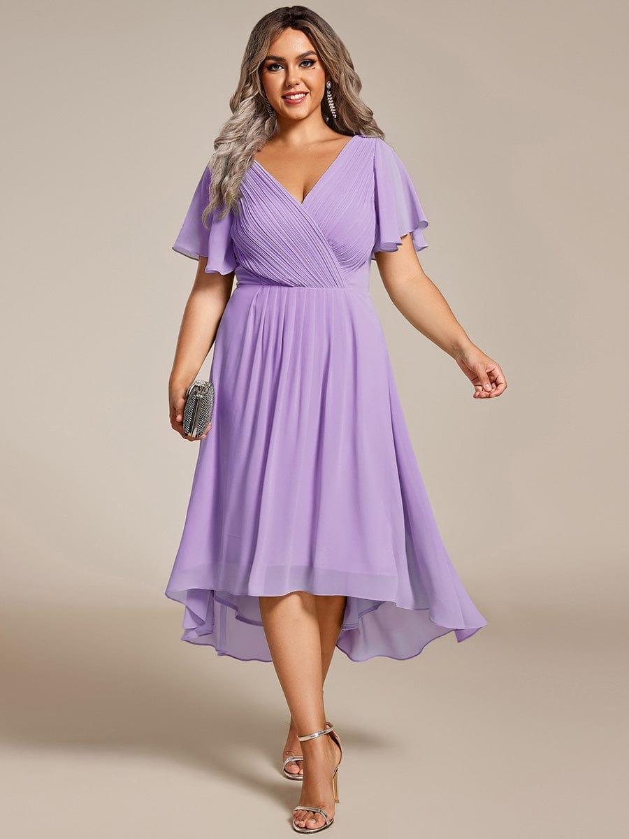 Plus size midi dress in blush pink with a double V-neck and ruffle sleeves, perfect for wedding guests. 18