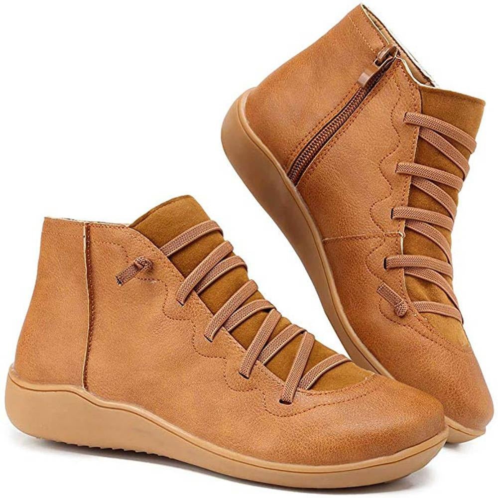 Tan women's ankle boots with a criss-cross lace detail and a side zip.