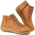 Tan women's ankle boots with a criss-cross lace detail and a side zip.