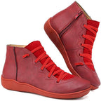 Women's ankle boots with a criss-cross lace detail and a side zip.