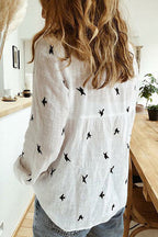 Flora cotton linen top in soft white, featuring a relaxed, casual style with a lightweight, breathable fabric. 1