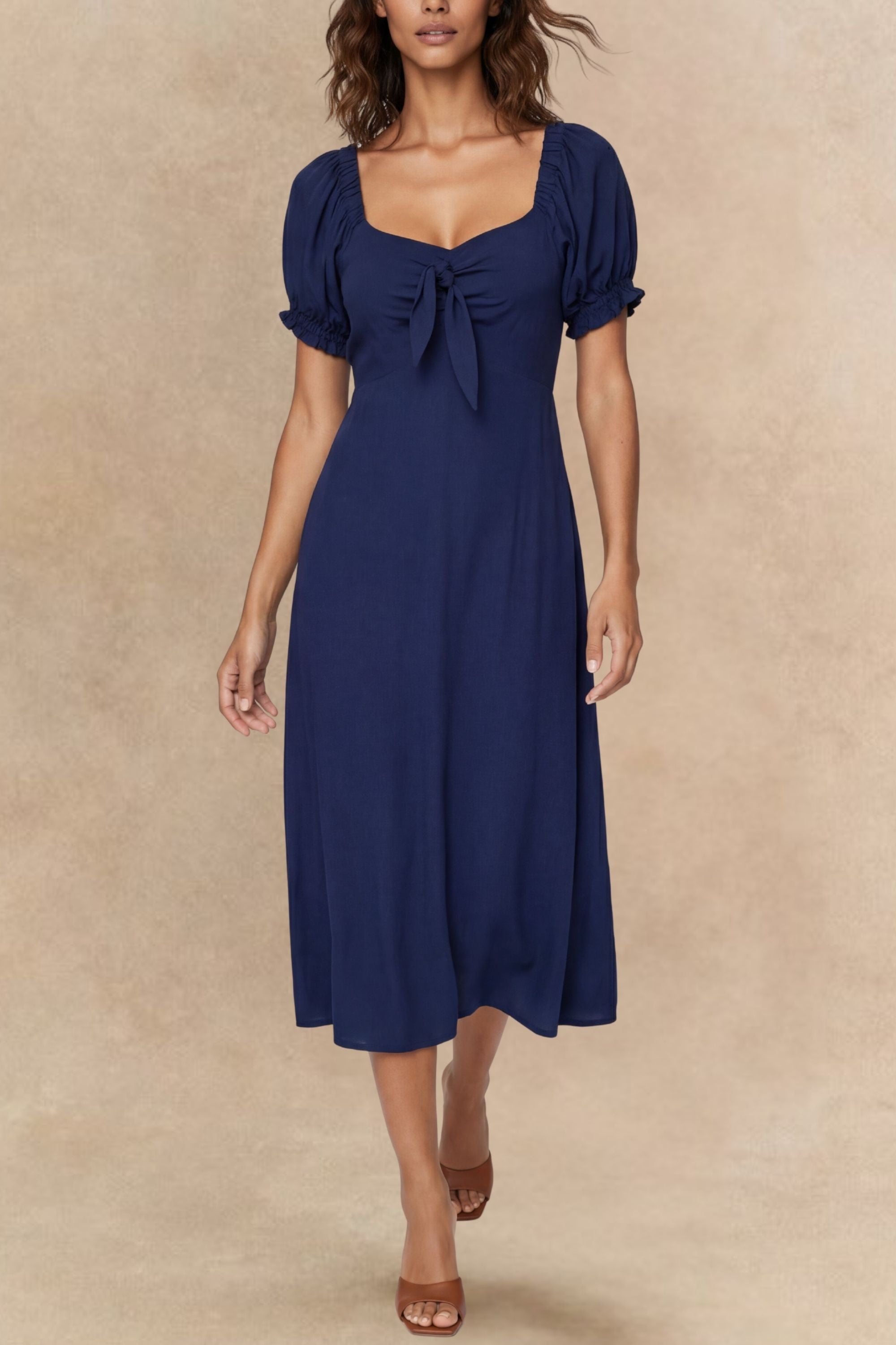 A green fit and flare midi dress with short sleeves and a front tie detail. 0