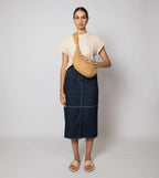 Cream cropped sweater vest in a cozy cable knit style, made from organic cotton for a soft, textured look. 3