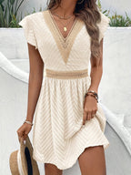 Light and airy white summer dress with a sweetheart neckline and flowy silhouette. 0
