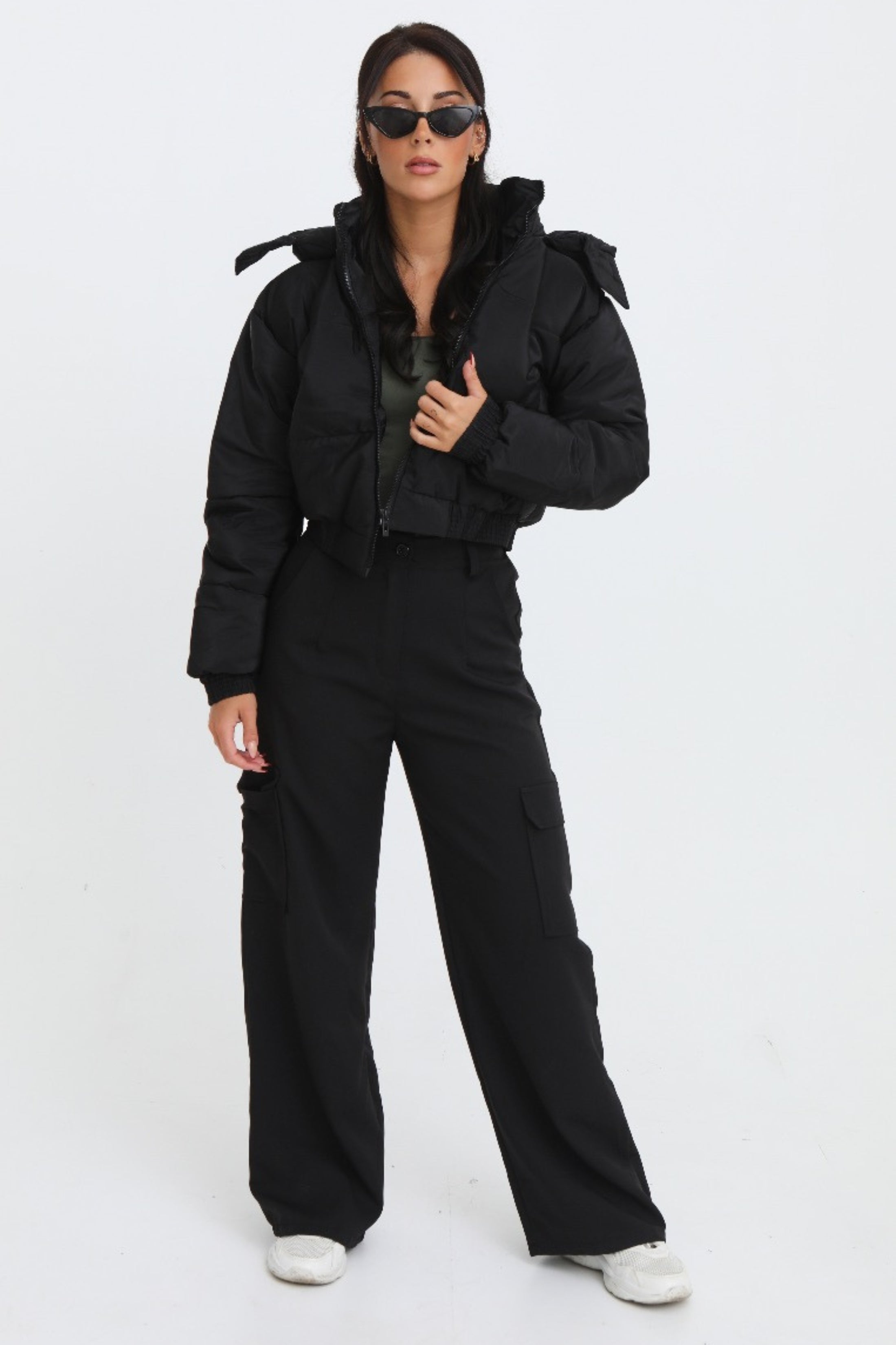 Black cropped padded jacket with long sleeves and zip front, featuring a modern and casual style. 1