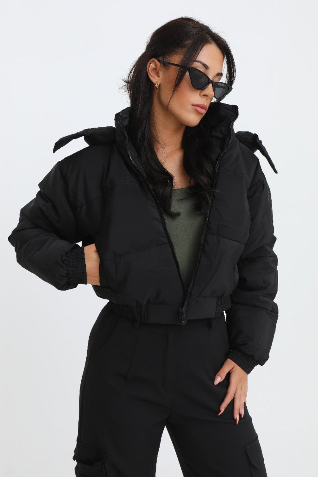 Black cropped padded jacket with long sleeves and zip front, featuring a modern and casual style. 5