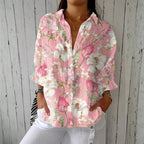 Relaxed button-down blouse in blue with a floral print. 1