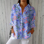 Relaxed button-down blouse in blue with a floral print. 2