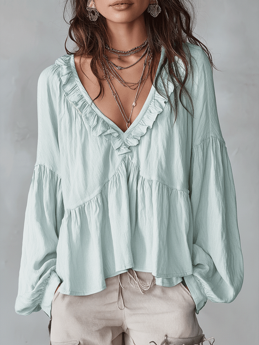 White vintage-inspired blouse with ruffles, perfect for summer. Lightweight and airy design. 1