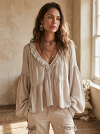 White vintage-inspired blouse with ruffles, perfect for summer. Lightweight and airy design. 2