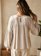 White vintage-inspired blouse with ruffles, perfect for summer. Lightweight and airy design. 3