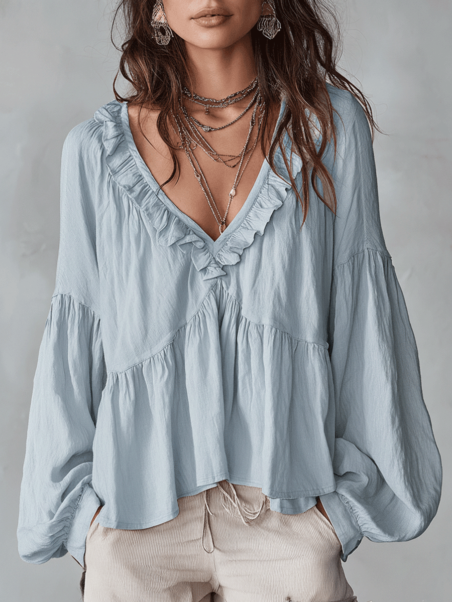 White vintage-inspired blouse with ruffles, perfect for summer. Lightweight and airy design. 5