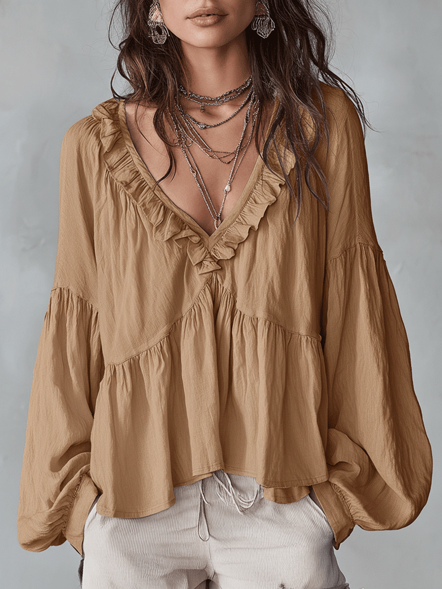 White vintage-inspired blouse with ruffles, perfect for summer. Lightweight and airy design. 6