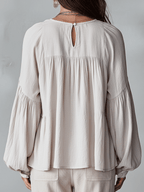 White vintage-inspired blouse with ruffles, perfect for summer. Lightweight and airy design. 8