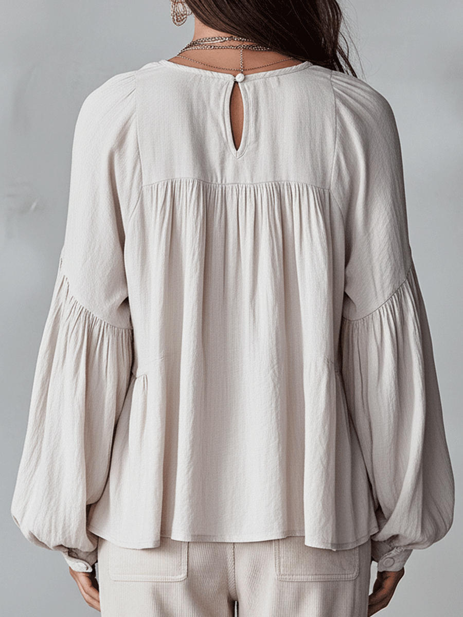 White vintage-inspired blouse with ruffles, perfect for summer. Lightweight and airy design. 8