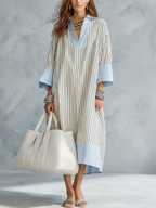 Striped midi dress in soft pastel colors, featuring a tailored fit and breathable fabric for comfort. 1