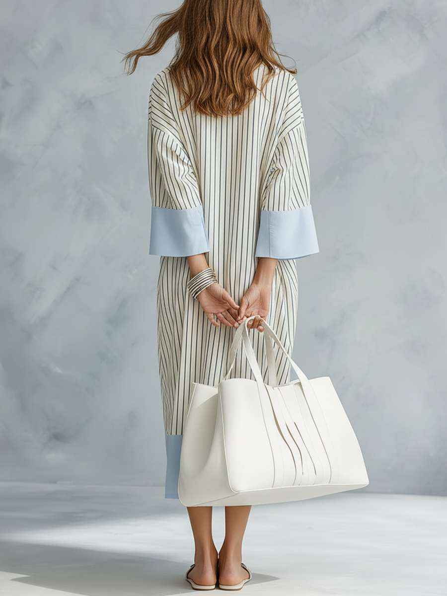 Striped midi dress in soft pastel colors, featuring a tailored fit and breathable fabric for comfort. 6