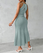Light blue halter tie summer dress with a criss-cross front and side slit, featuring a knit jacquard pattern. 1