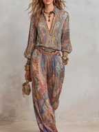 Wide leg pantsuit in navy with a paisley print, featuring a relaxed fit for a comfortable, stylish look. 8