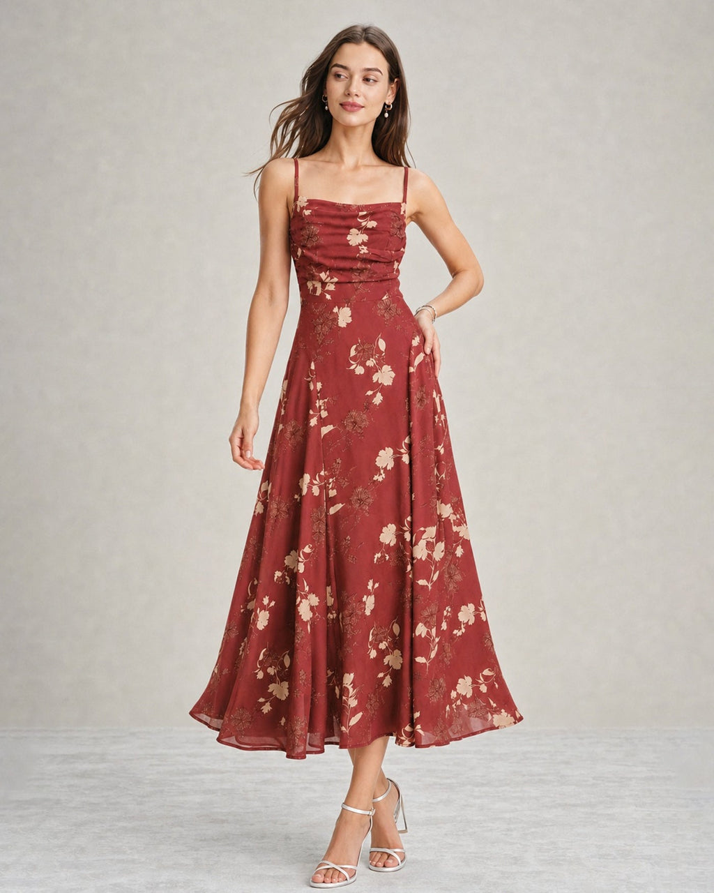 A red floral maxi dress featuring a square neckline and sleeveless design, showcasing a vibrant and feminine style. 0