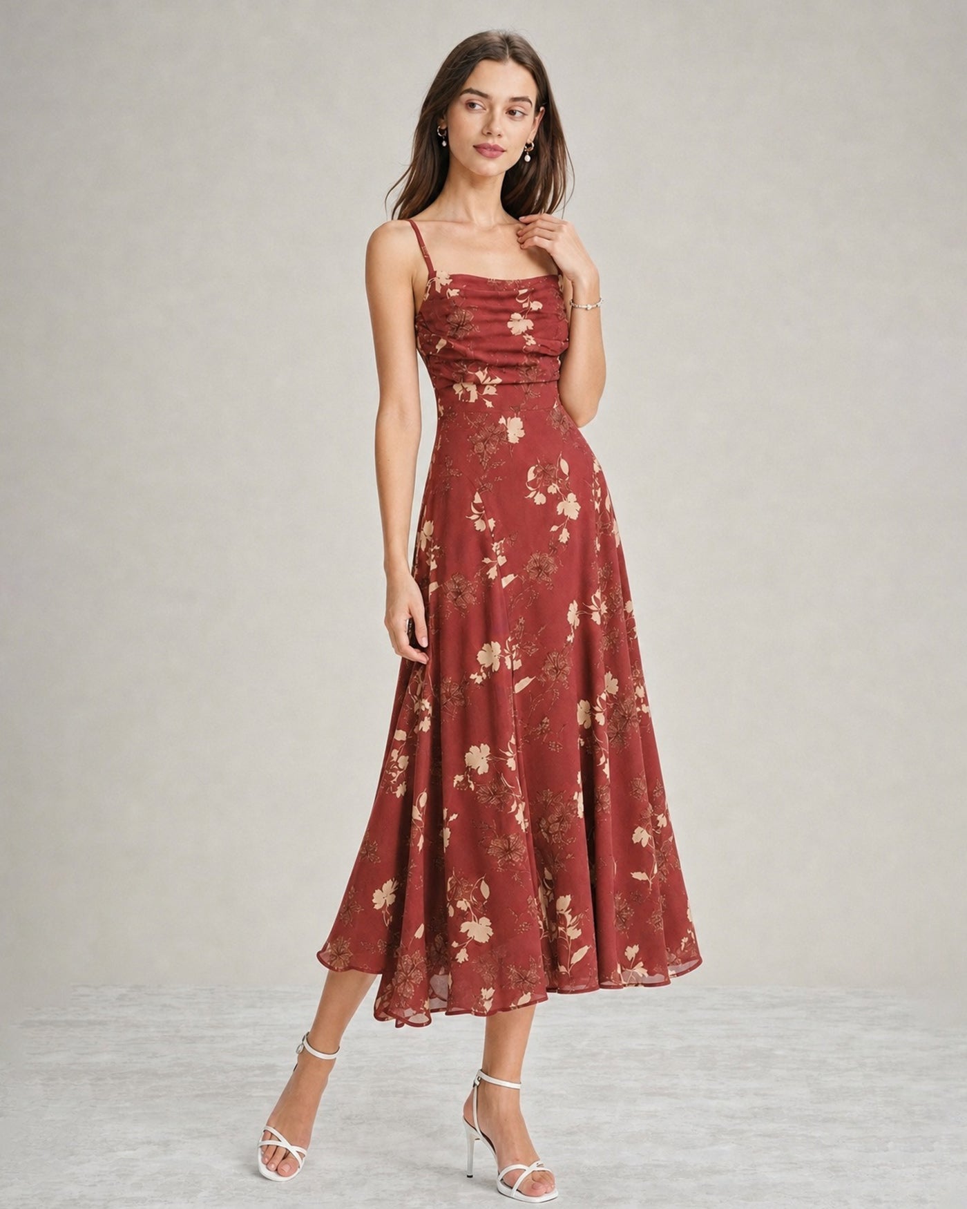 A red floral maxi dress featuring a square neckline and sleeveless design, showcasing a vibrant and feminine style. 2
