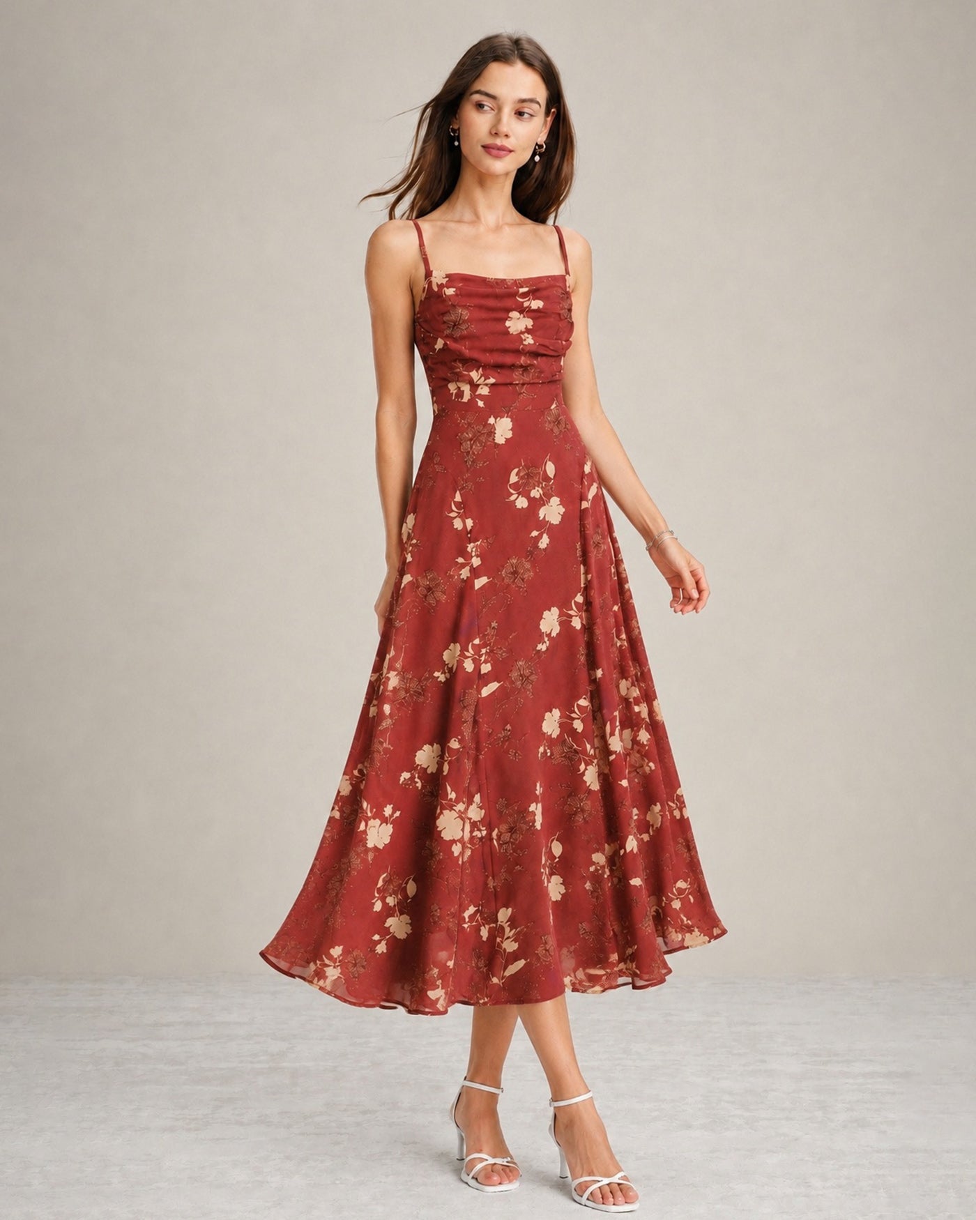 A red floral maxi dress featuring a square neckline and sleeveless design, showcasing a vibrant and feminine style. 3