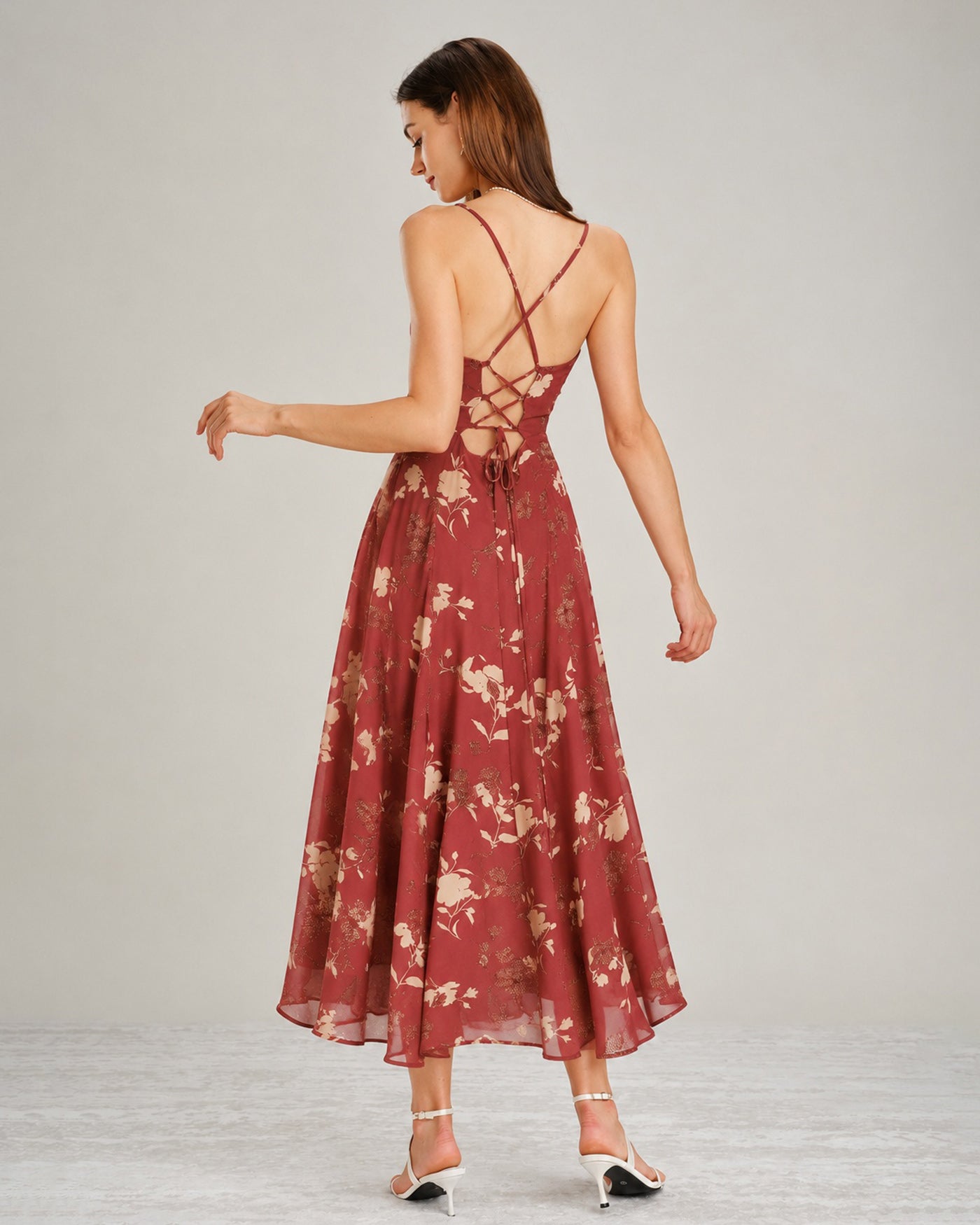 A red floral maxi dress featuring a square neckline and sleeveless design, showcasing a vibrant and feminine style. 4