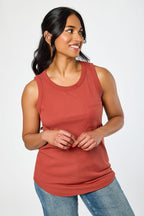 White ribbed sleeveless tank top, crew-neck style, relaxed fit, perfect for casual layering. 12