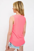 White ribbed sleeveless tank top, crew-neck style, relaxed fit, perfect for casual layering. 4