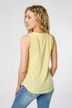White ribbed sleeveless tank top, crew-neck style, relaxed fit, perfect for casual layering. 7