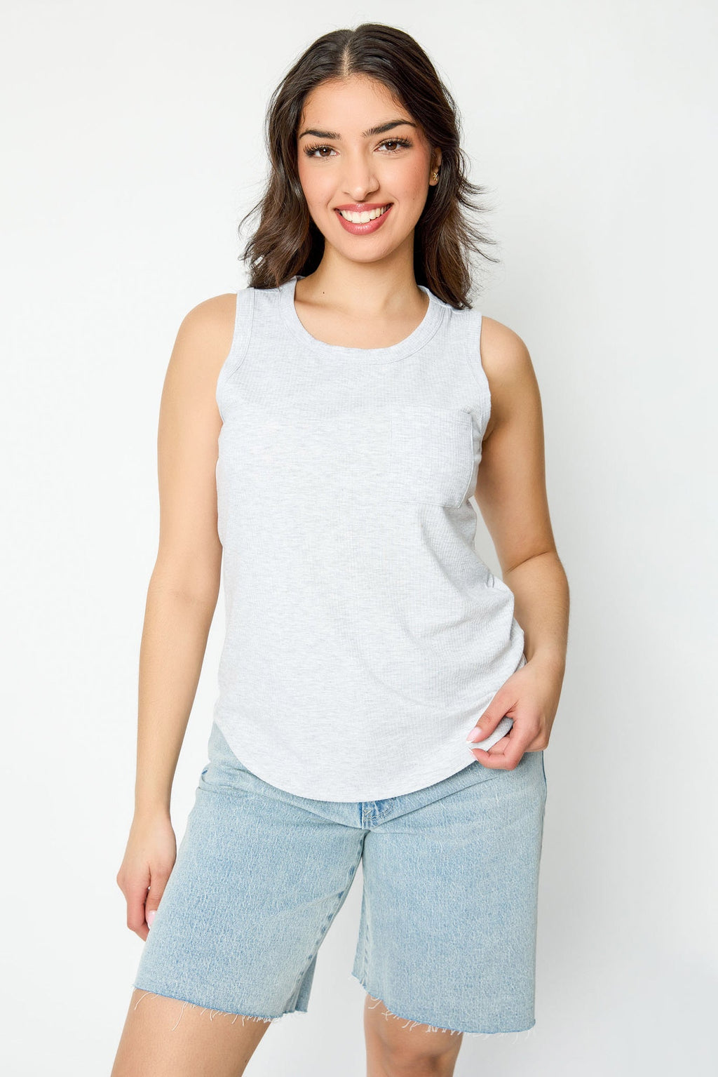 White ribbed sleeveless tank top, crew-neck style, relaxed fit, perfect for casual layering. 8