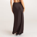 Chocolate satin fitted maxi skirt with an elasticated waistband, offering a sleek and elegant silhouette. 1