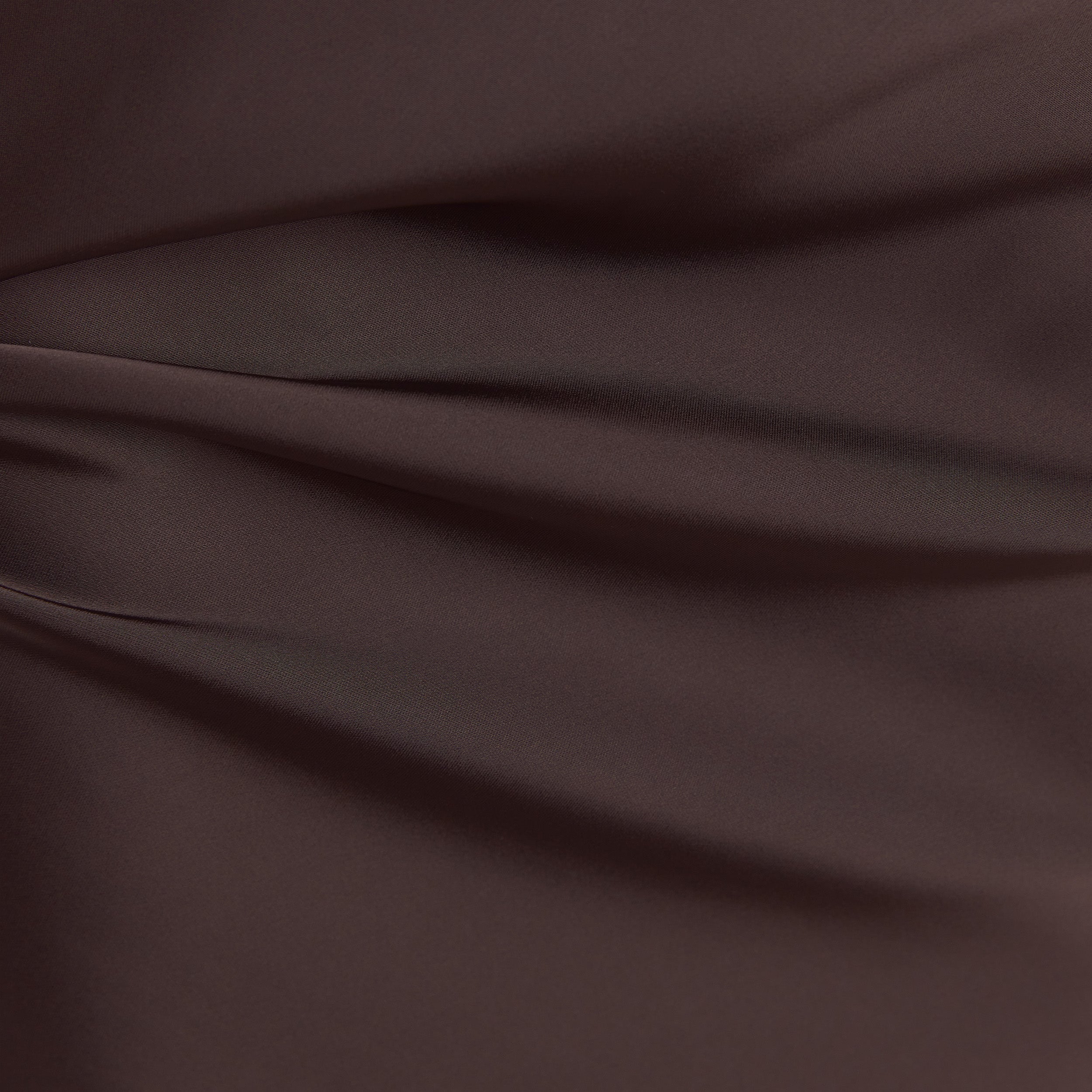 Chocolate satin fitted maxi skirt with an elasticated waistband, offering a sleek and elegant silhouette. 3