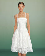 White midi dress with floral jacquard in an A-line silhouette, featuring a classic and elegant style. 3