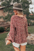 Rust floral babydoll top with a V-cut neckline and long sleeves, featuring a relaxed and feminine style. 2