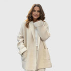 Longline ribbed cardigan for women with a shawl collar and deep patch pockets.