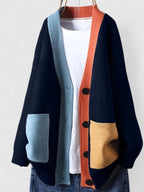 Colour block knit cardigan for women with contrast patch pockets.