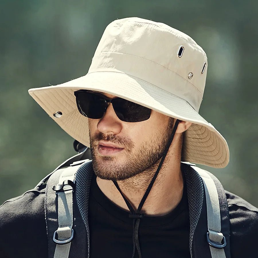 Lightweight beige bucket hat with UPF50+ protection, perfect for outdoor activities and casual wear. 1